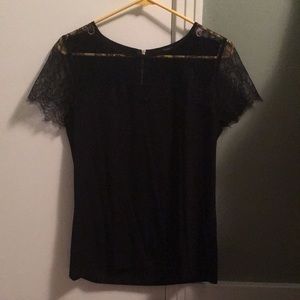 Black, short sleeve top with lace detailing!